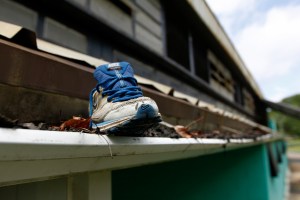 A shoe sits in the rain gutter at the MLK Center gym in McComb, Miss. By Philip Hall, Enterprise-Journal.